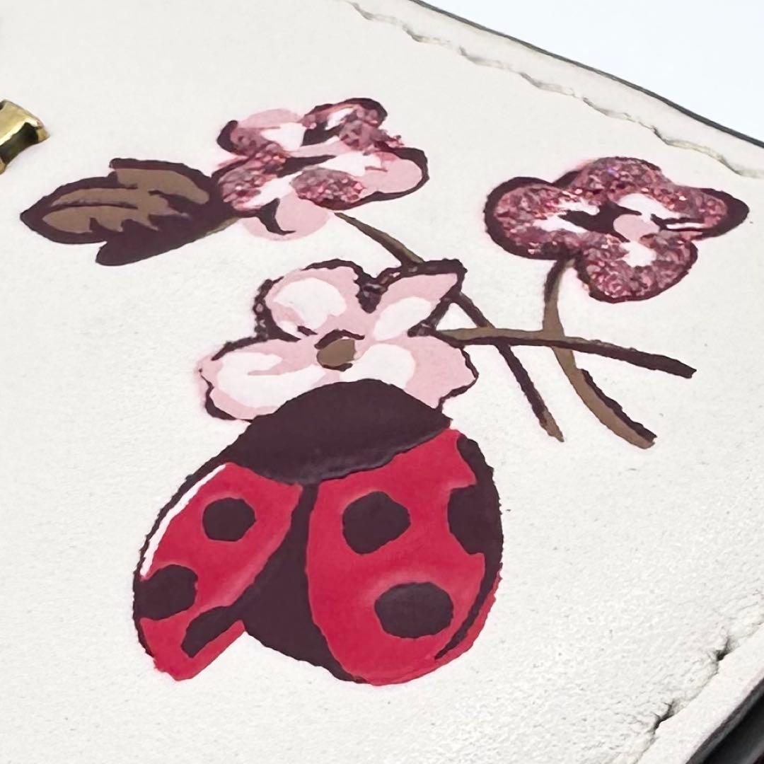 美品✨COACH コーチ 二つ折り財布 レザー てんとう虫 フローラル 日本限定