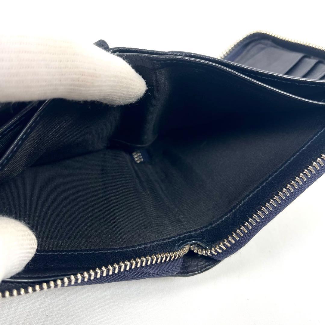 ジミーチュウ　折り財布　ラウンドファスナー　スター　エンボスレザー　星　ロゴ