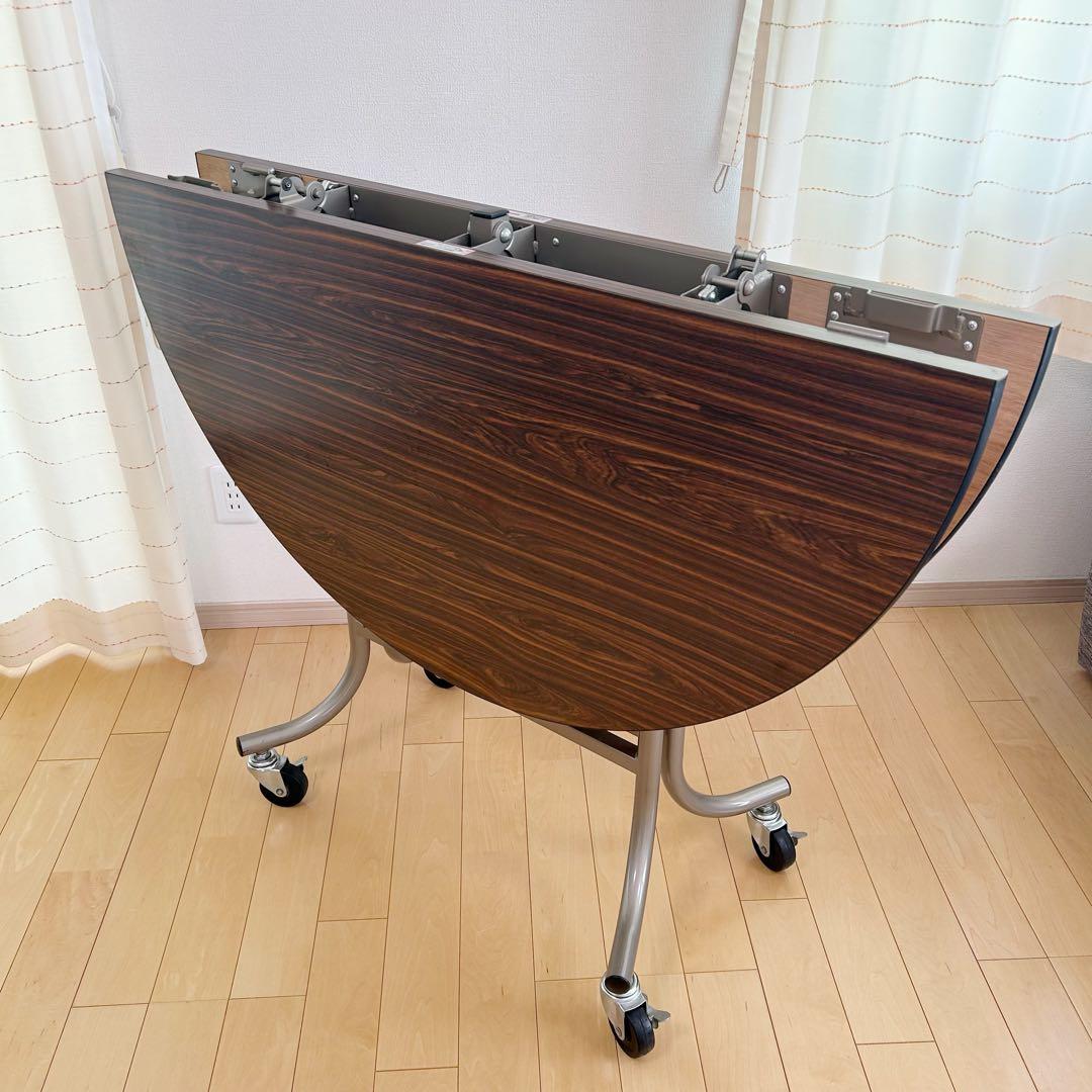 フライト式円型テーブル　折りたたみテーブル　直径120cm 丸テーブルキャスター