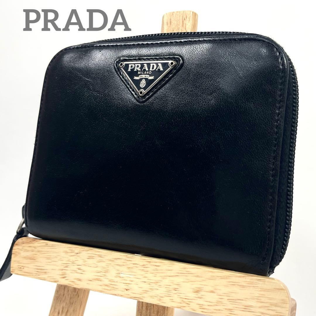 プラダ　二つ折り財布　ラウンドファスナー　三角ロゴプレート　レザー　ブラック