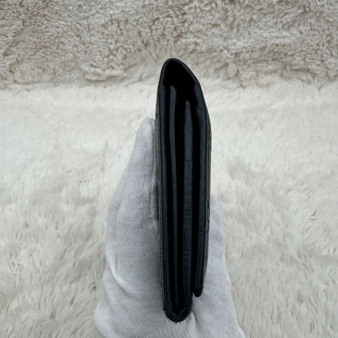 ✨美品✨グッチ　長財布　二つ折り財布　GG柄 ロゴプレート　レザー　黒