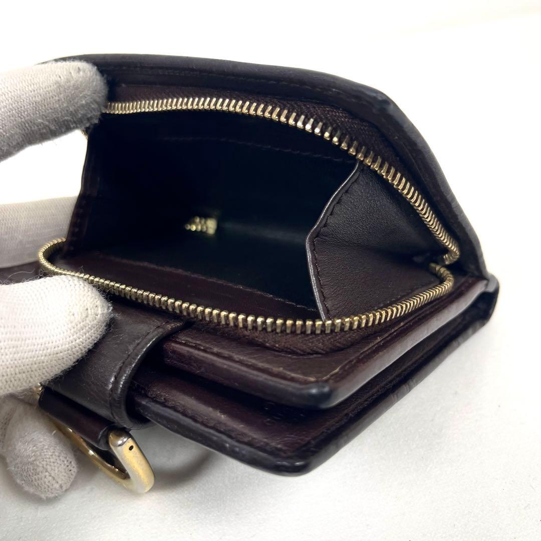 グッチ　二つ折り財布　アビー　シマレザー　ラウンドファスナー　ロゴ　エンボス