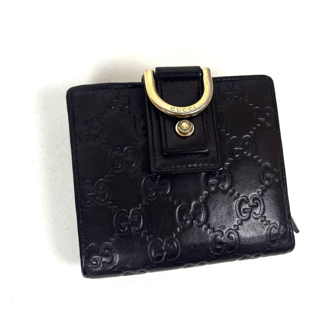 グッチ　二つ折り財布　アビー　シマレザー　ラウンドファスナー　ロゴ　エンボス