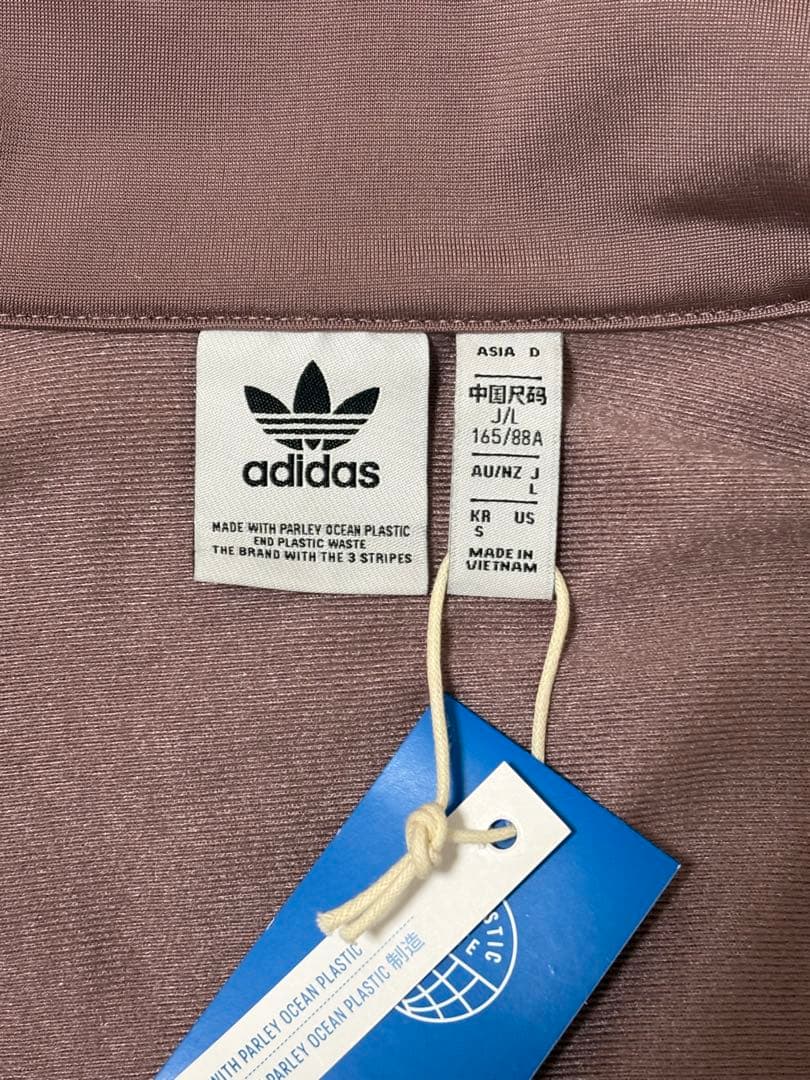 adidas くすみピンク ファイヤーバード 襟高 トラックトップ ジャージ