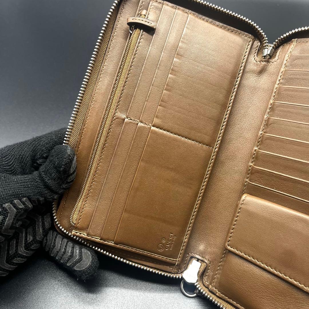 グッチ 長財布 オーガナイザー ラウンドファスナー マイクロシマ GG柄 茶