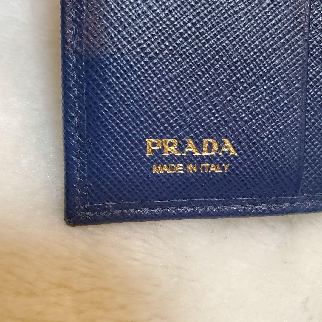 美品　PRADA 折り財布 サフィアーノ メタルロゴ リボン ブルー
