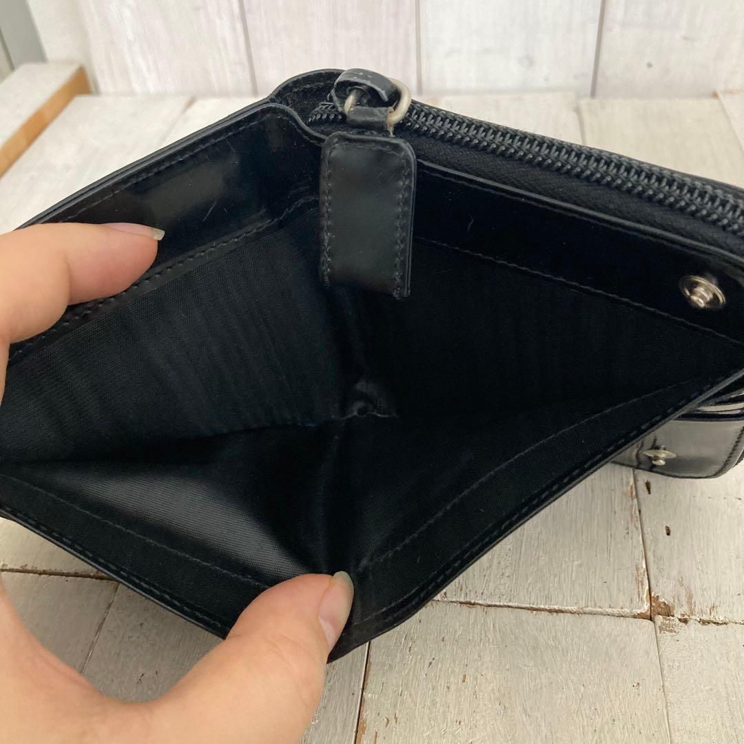 PRADA プラダ 折り財布 エナメル ラウンドジップ 型押しロゴ ブラック