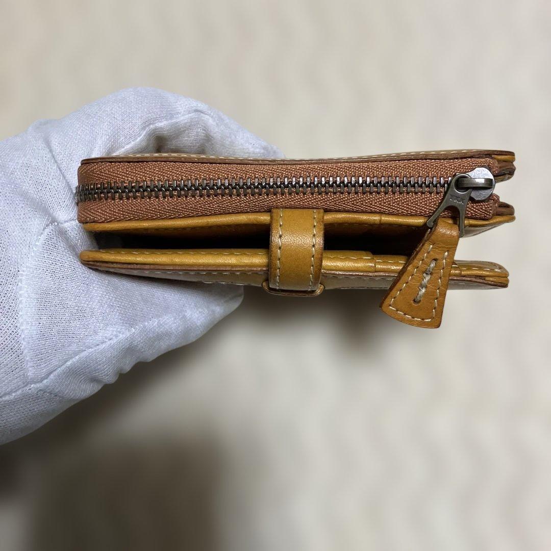 (美品) genten ゲンテン　カットワークレザー　二つ折り財布　オシャレ