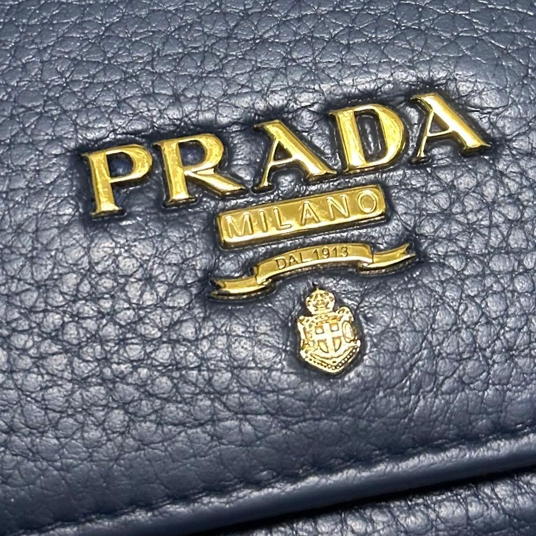 PRADA プラダ　折り財布　ゴールドロゴ　ブルー　シボ革