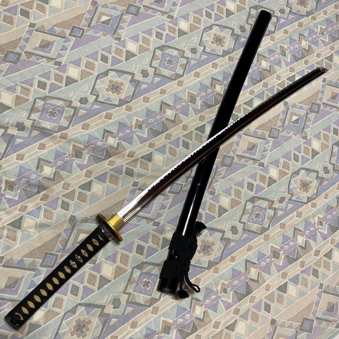 上級居合刀 黒柄 鶴波図楕円鍔 黒呂鞘