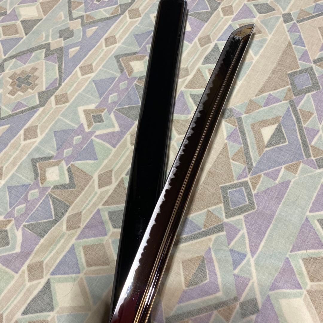 上級居合刀 黒柄 鶴波図楕円鍔 黒呂鞘