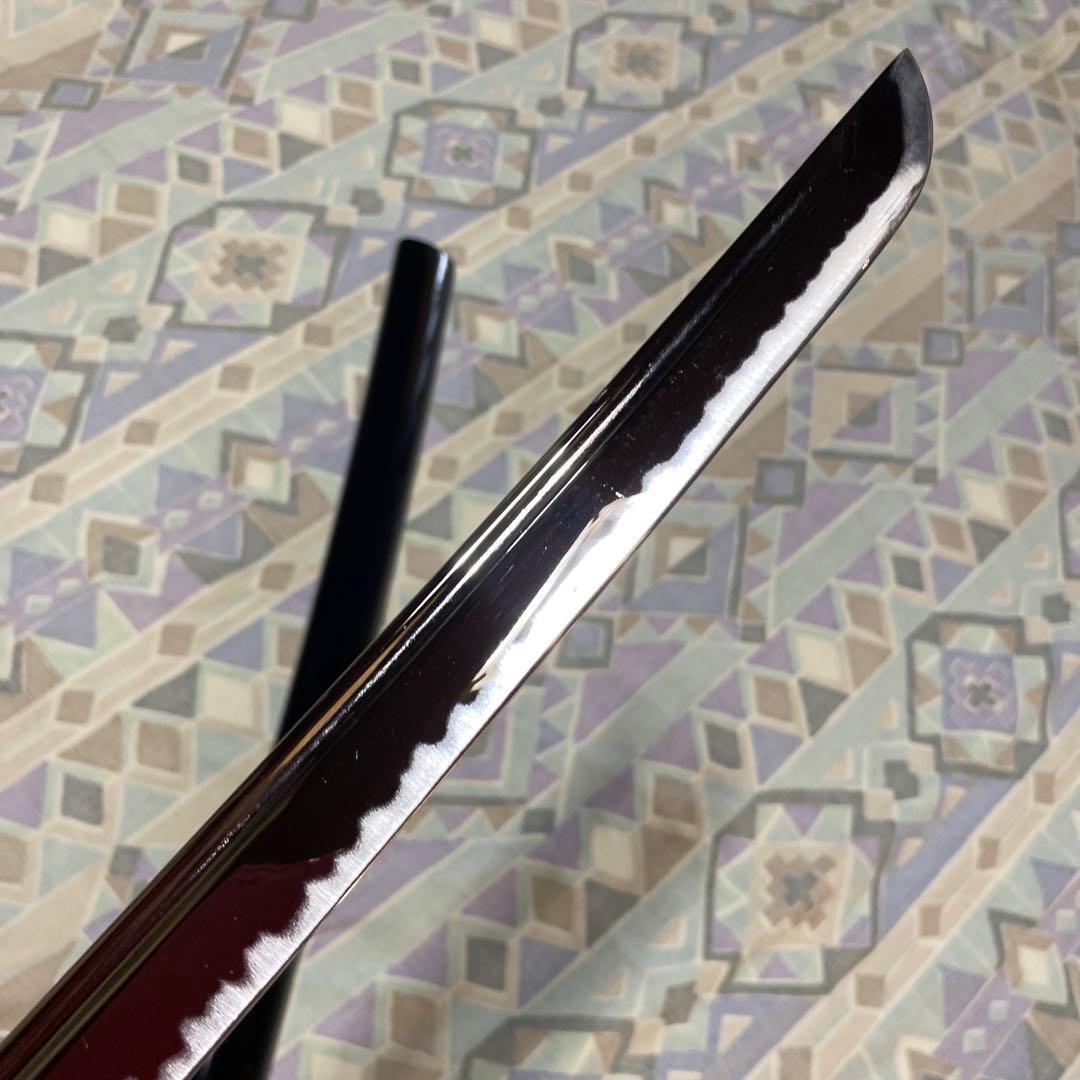 上級居合刀 黒柄 鶴波図楕円鍔 黒呂鞘