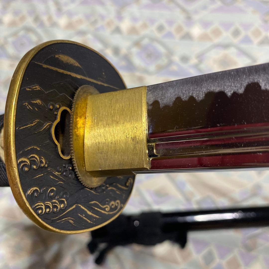 上級居合刀 黒柄 鶴波図楕円鍔 黒呂鞘