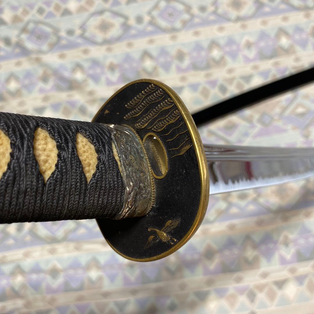 上級居合刀 黒柄 鶴波図楕円鍔 黒呂鞘