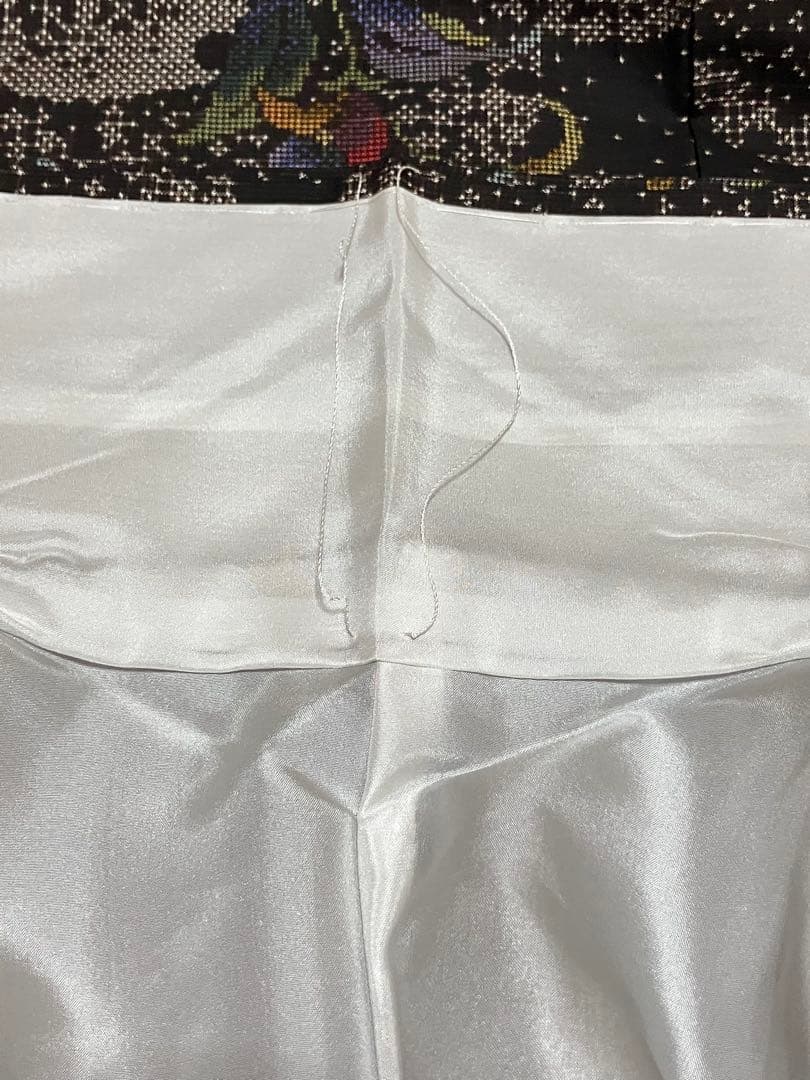 本場奄美大島紬 衣の音 経緯絣 小紋正絹 雪輪 花唐草 証紙 未使用 イ6013