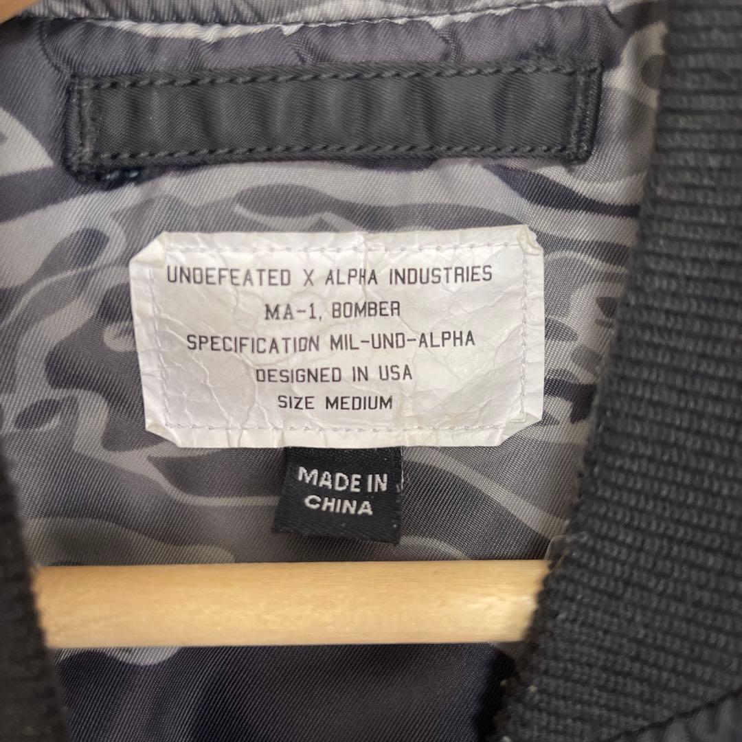 ジャケット・アウター UNDEFEATED X ALPHA INDUSTRIES MA-1