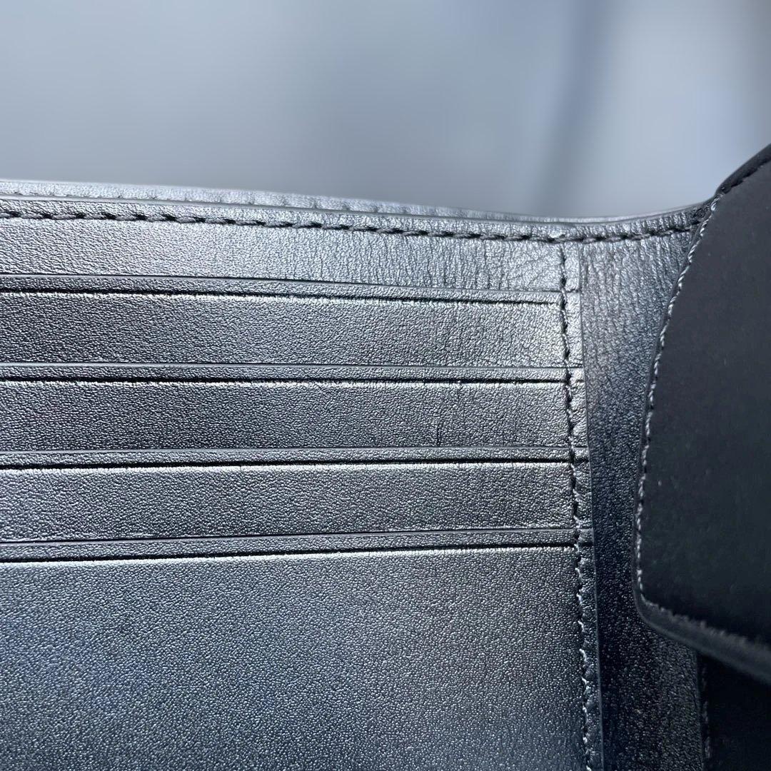 新品　定価55,000円　COACH ブラック　二つ折り財布 エンボス加工