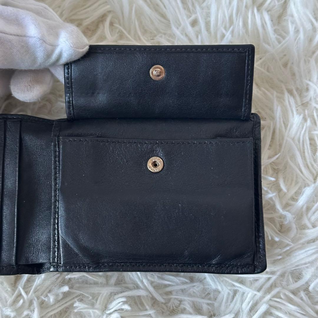 グッチ GGシマ 二つ折り財布 型押し レザー コンパクト 黒 総柄 エンボス