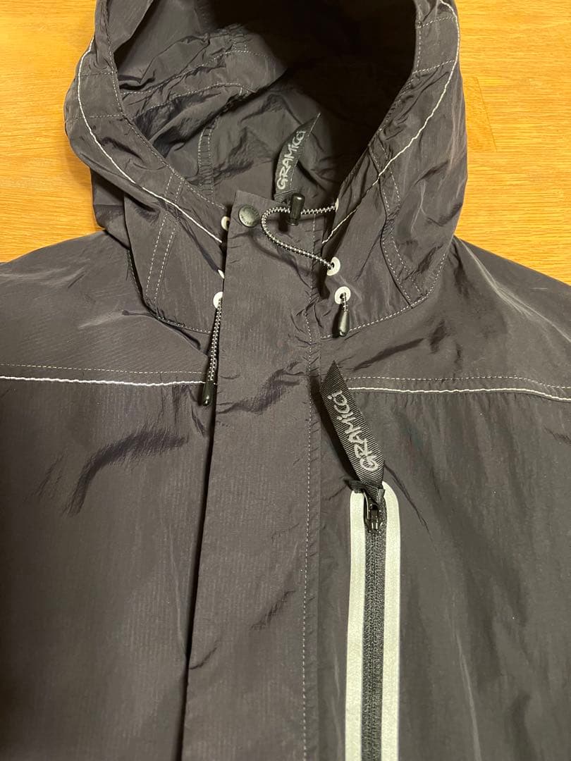 Gramicci x AND WANDERパッチワークウィンドパーカー Sサイズ