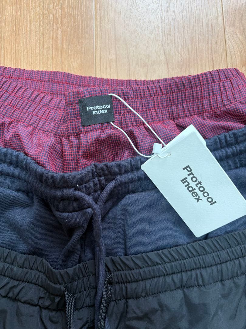 パンツ Protocol Index LAYERED TRACK PANTS / BLK