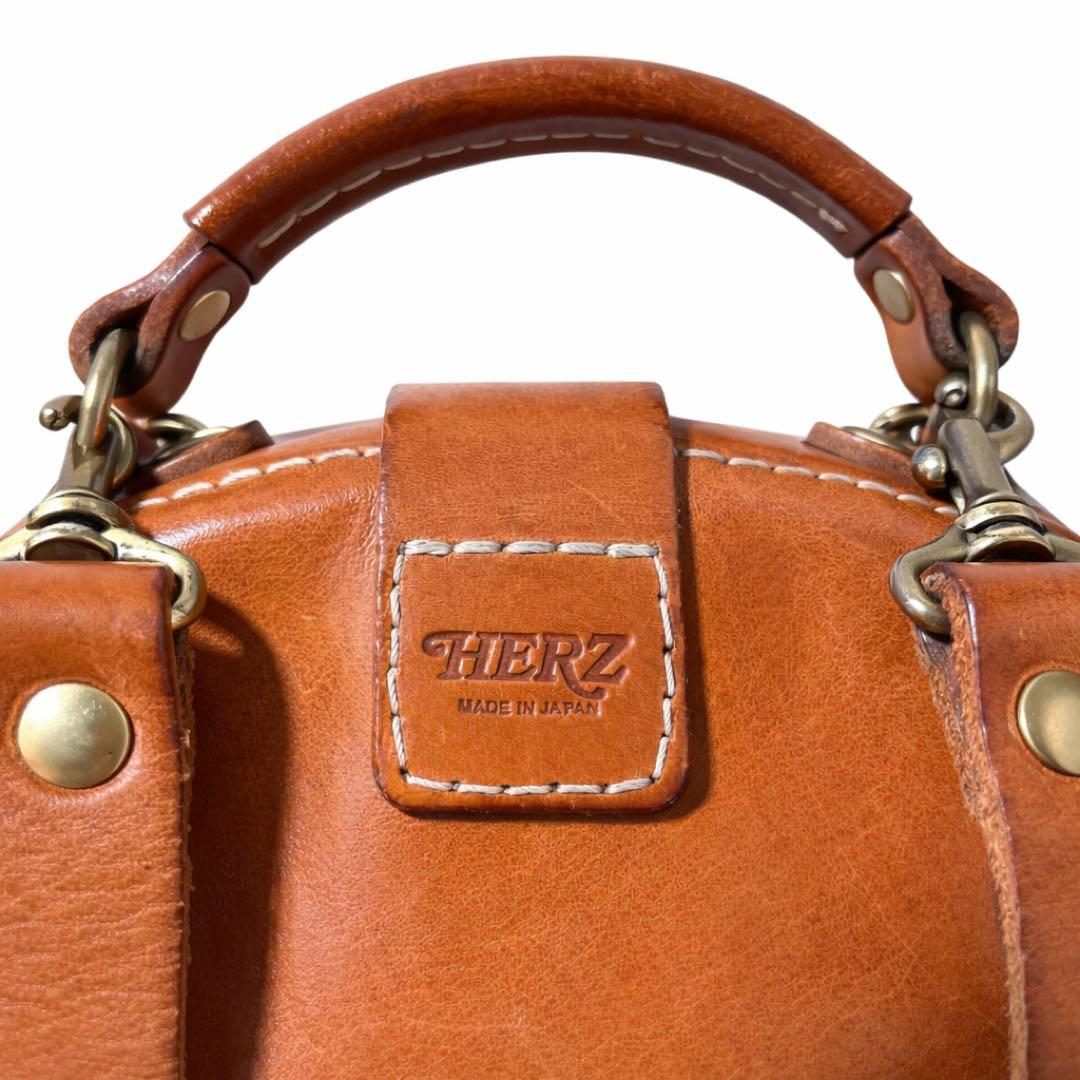 ヘルツ わんぱくリュック がま口 レザー バックパック ロック金具 鍵付き 茶