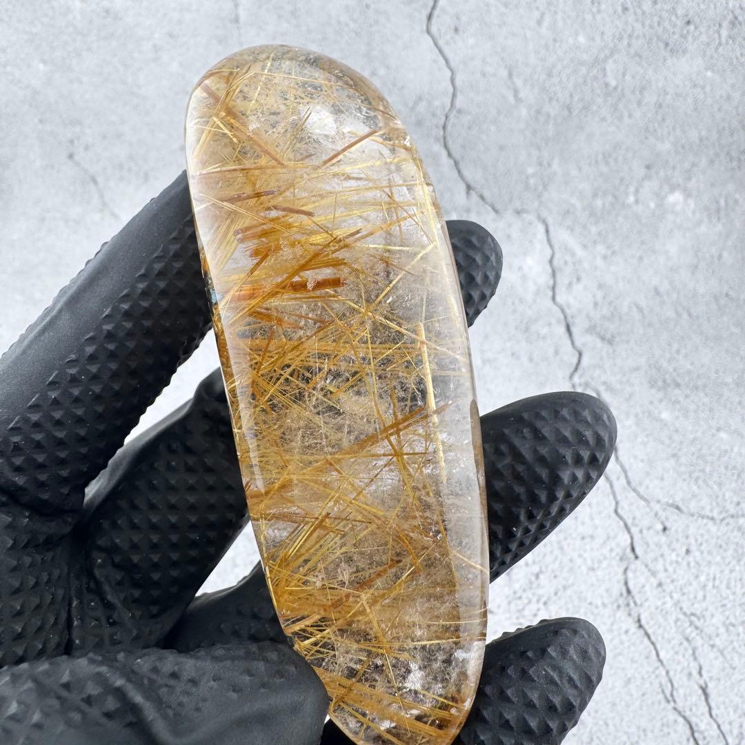 G-178タイチンルチル研磨石　ゴールドルチル放射状原石　天然石119g