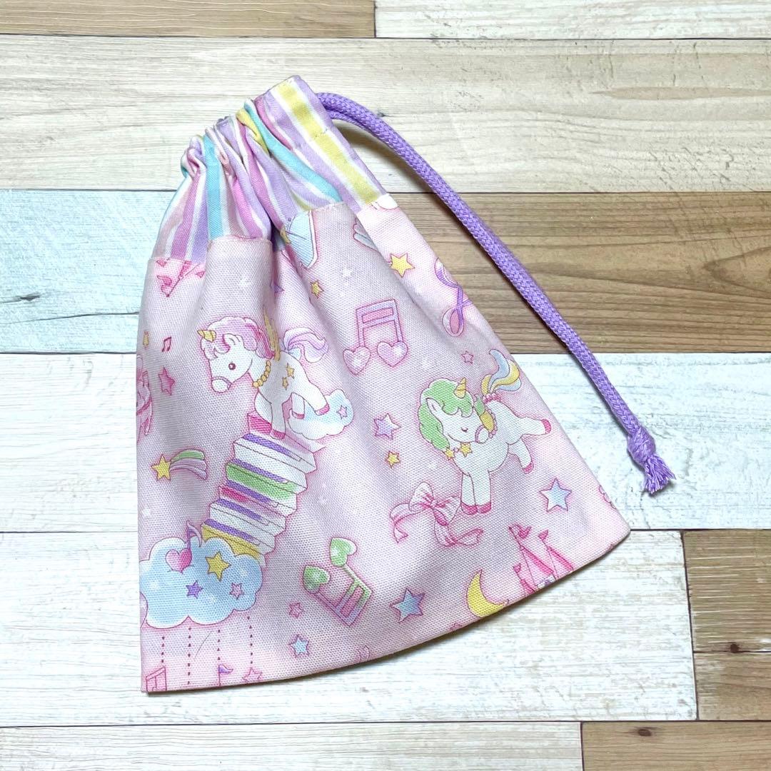 ハンドメイド★ピンク。ゆめかわユニコーンプリント片側紐出し巾着。入園 入学グッズ