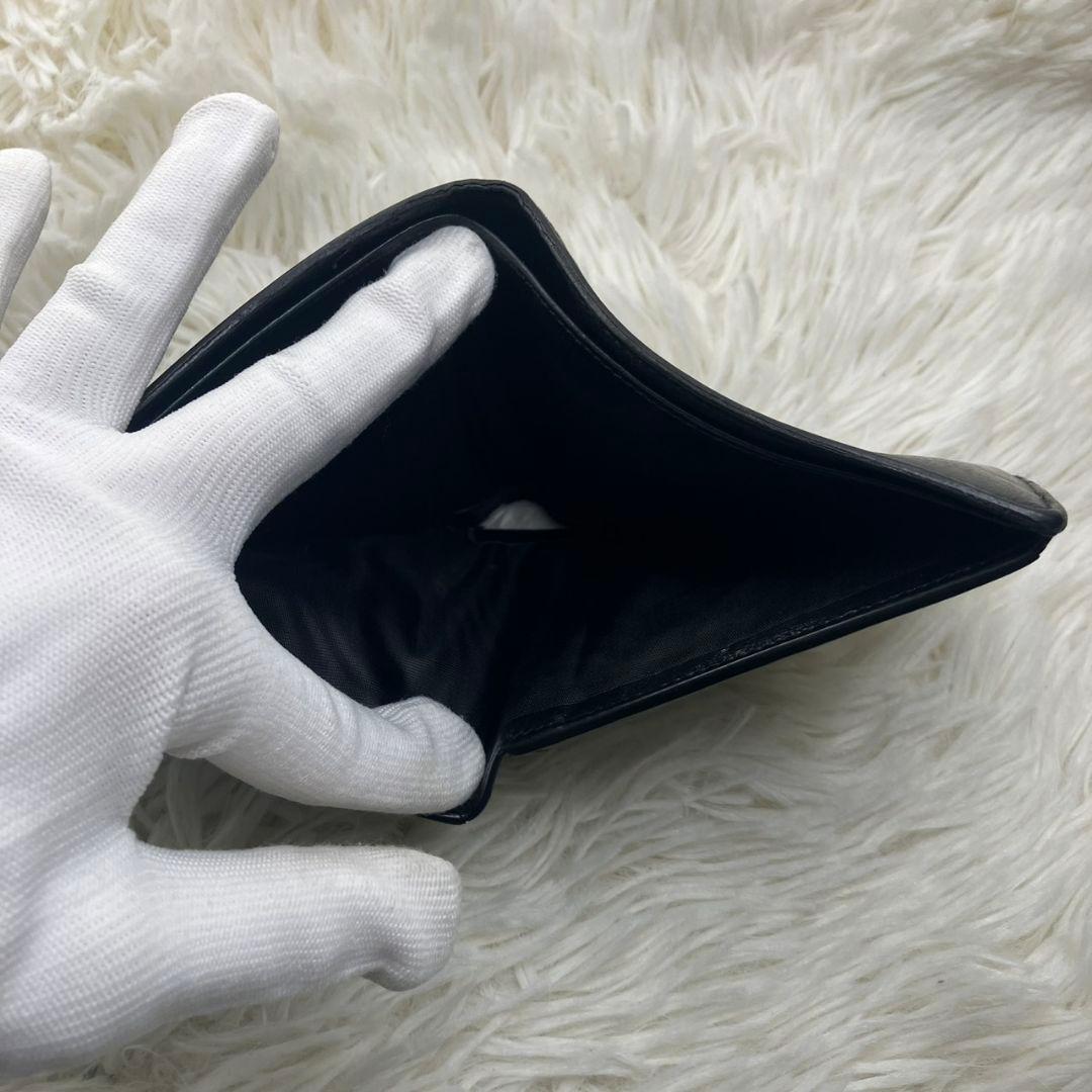 サンローラン 二つ折り財布 レザー カサンドラ 金具 ロゴ 黒 小銭入れ