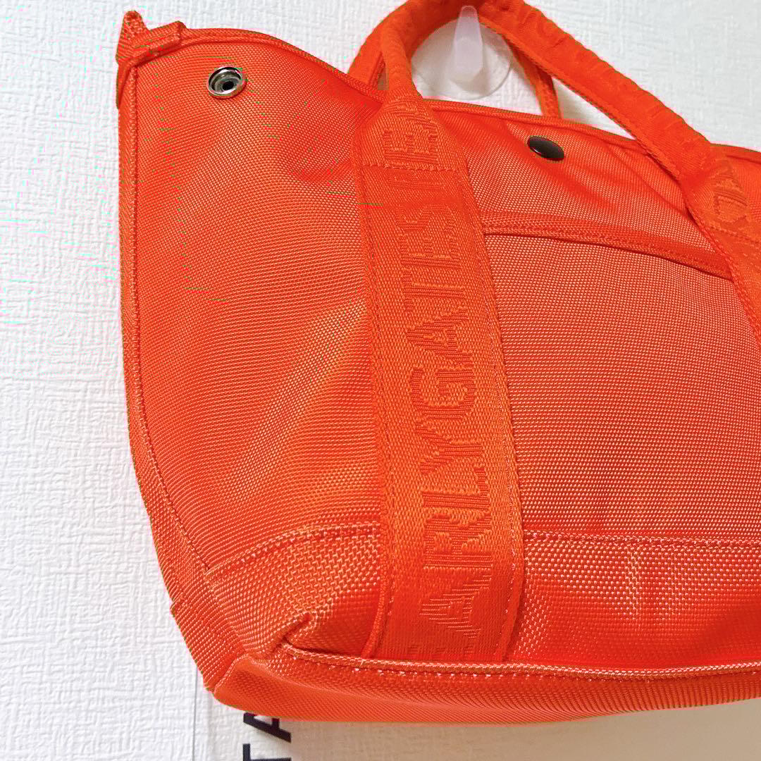 極美品 パーリーゲイツ ゴルフバッグ オレンジ ロゴチャーム付きカートバッグ