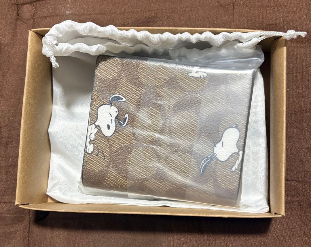 新品未使用 COACH 二つ折り財布 スヌーピー
