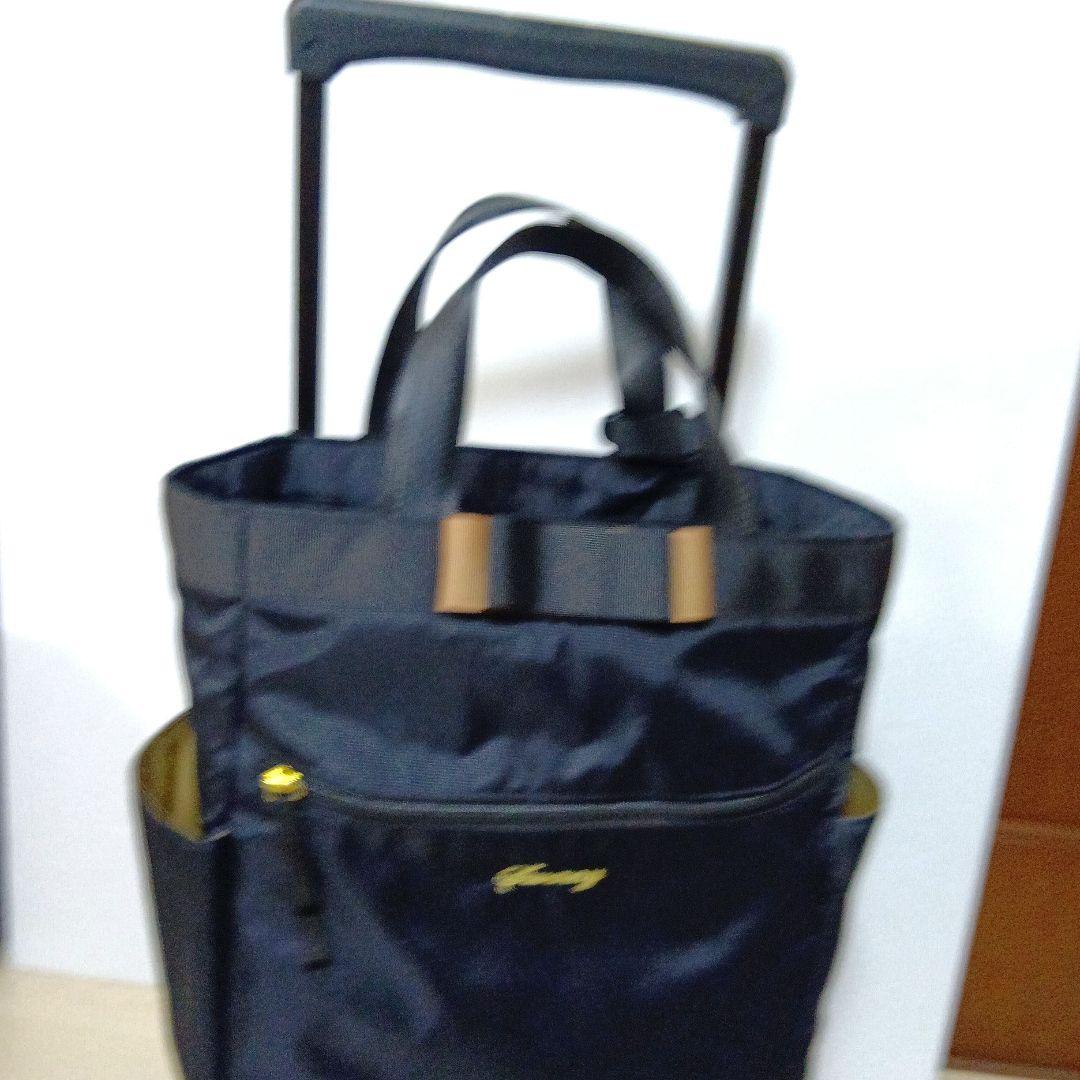 SWANY　スワニー4輪 キャリーバック　ケース 黒にリボン　ストッパー付き