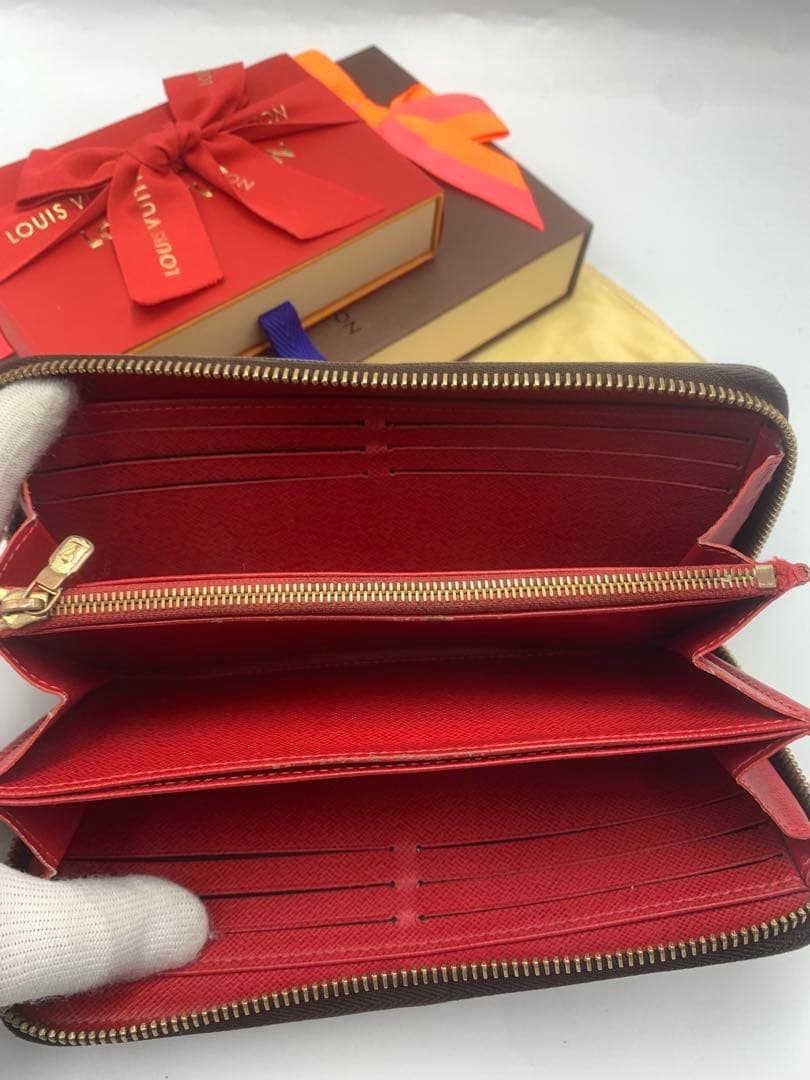 ルイヴィトン モノグラム ステッカー ジッピーウォレットコクリコ 長財布 P55