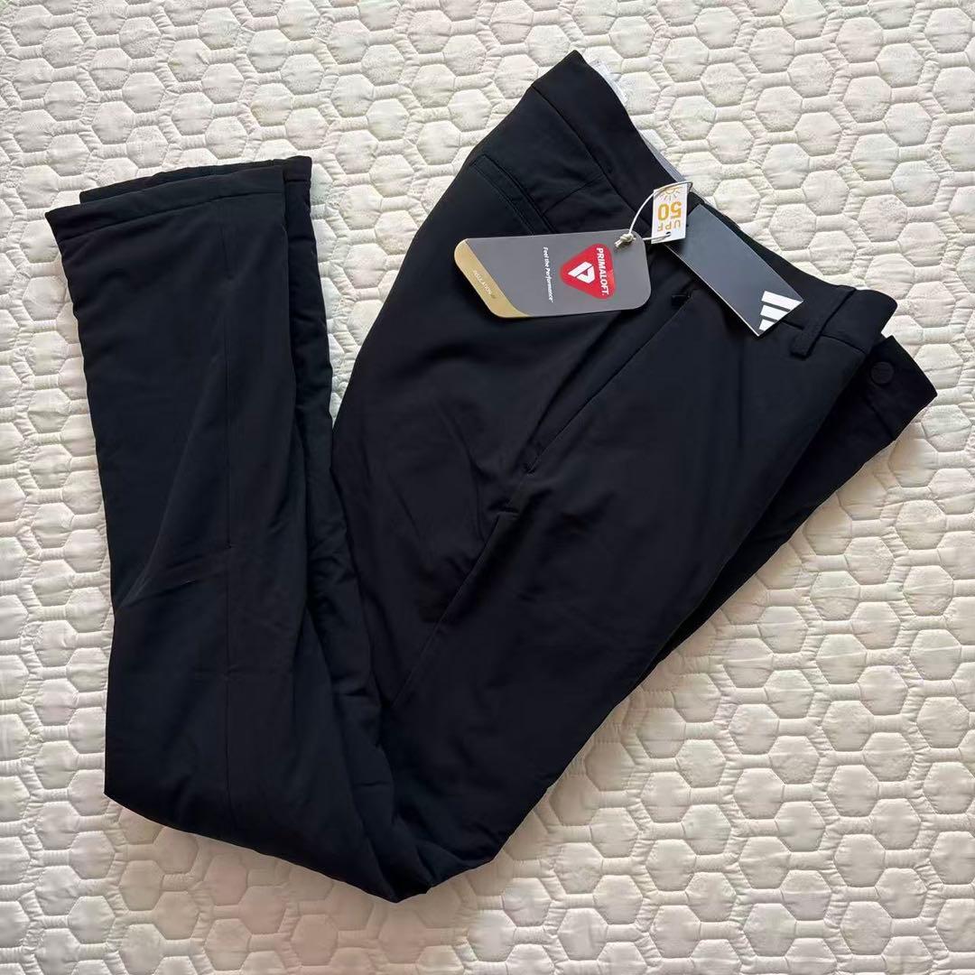 88新品27500円アディダスゴルフ/メンズ/秋冬/中綿ストレッチパンツ/黒