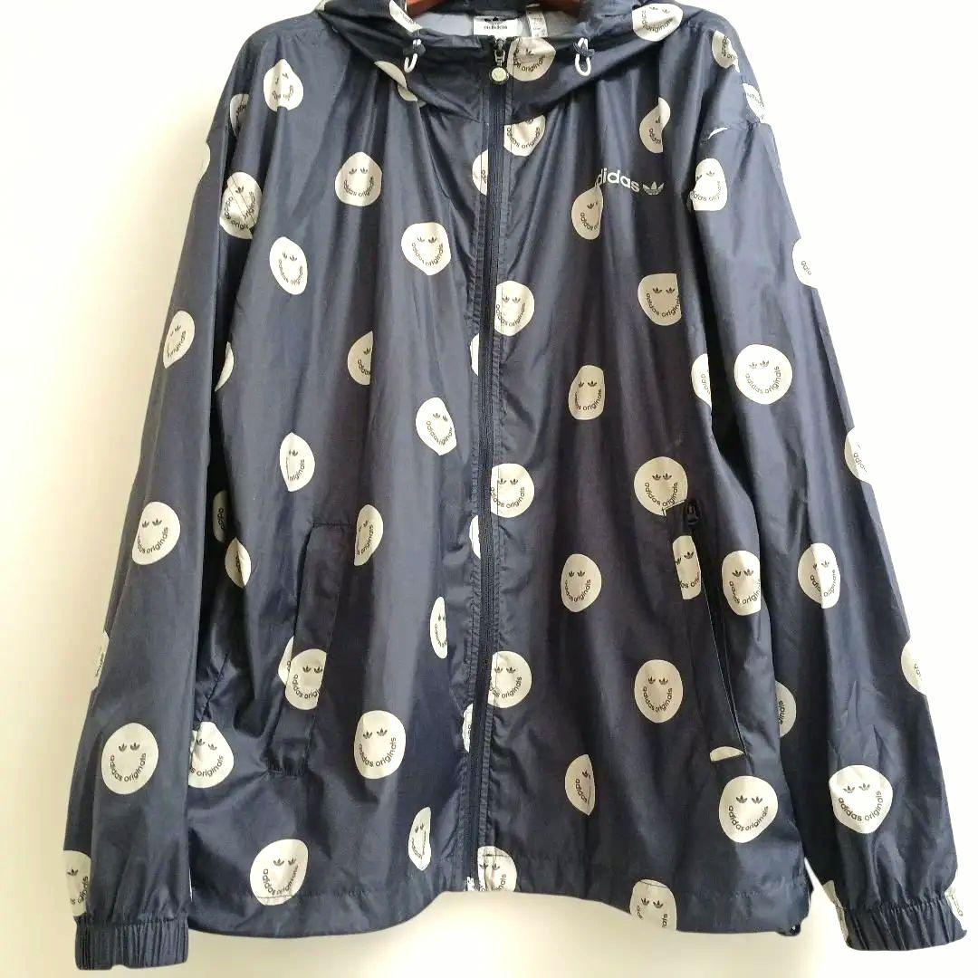 アディダスadidasプリントウィンドブレーカースマイリーフェイス