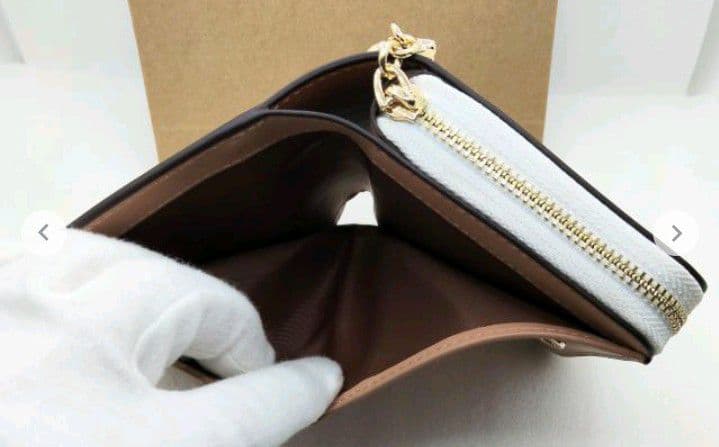 新品未使用コーチ二つ折り財布スヌーピー柄ホワイトレディースメンズ送料無料即日発送