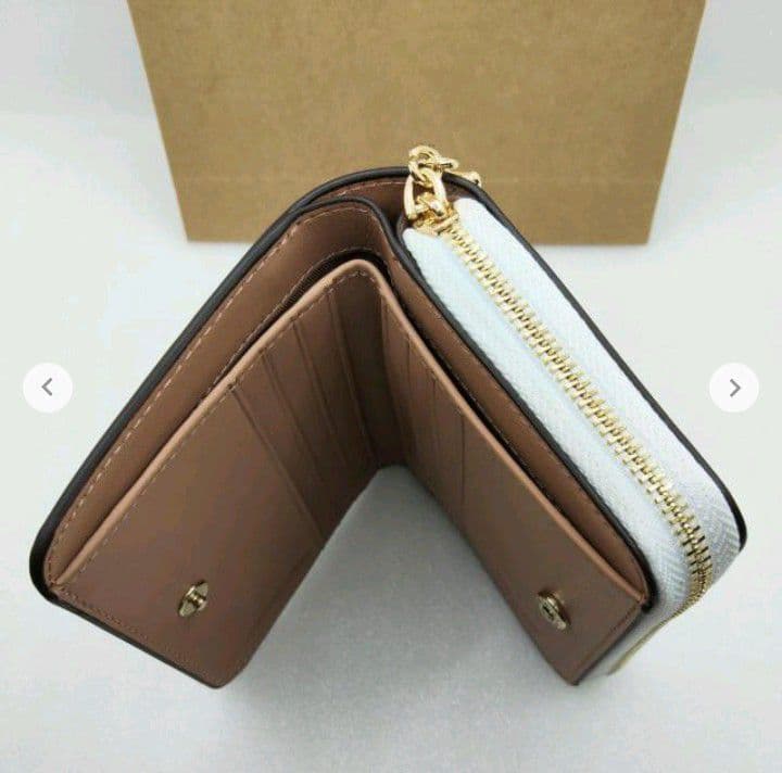 新品未使用コーチ二つ折り財布スヌーピー柄ホワイトレディースメンズ送料無料即日発送