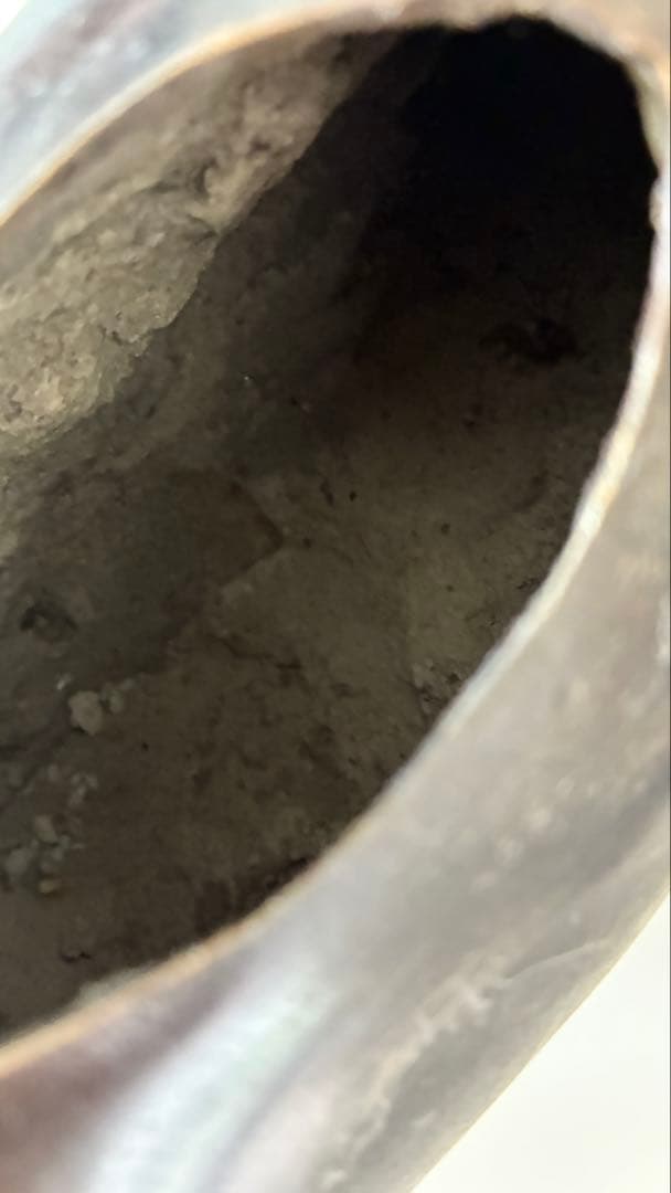 銅器牛に乗る人物像