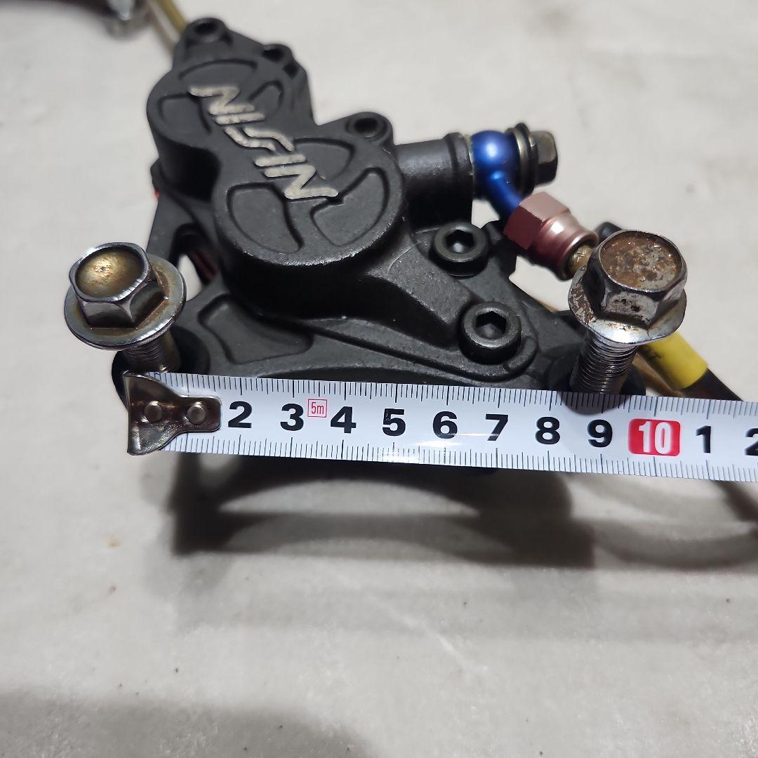 NISSIN ブレーキキャリパー ピッチ90 de11