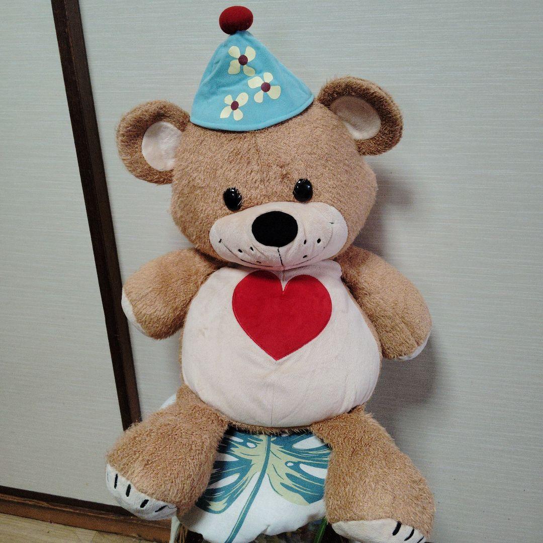 茶色いクマのぬいぐるみ 青い帽子付き
