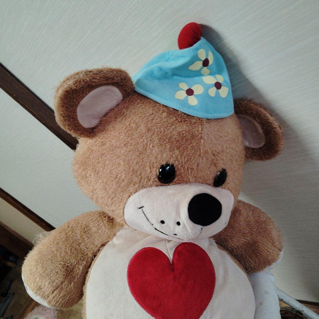 茶色いクマのぬいぐるみ 青い帽子付き