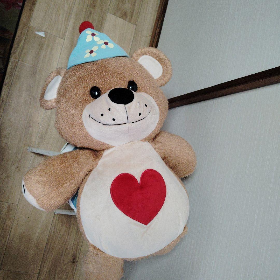 茶色いクマのぬいぐるみ 青い帽子付き