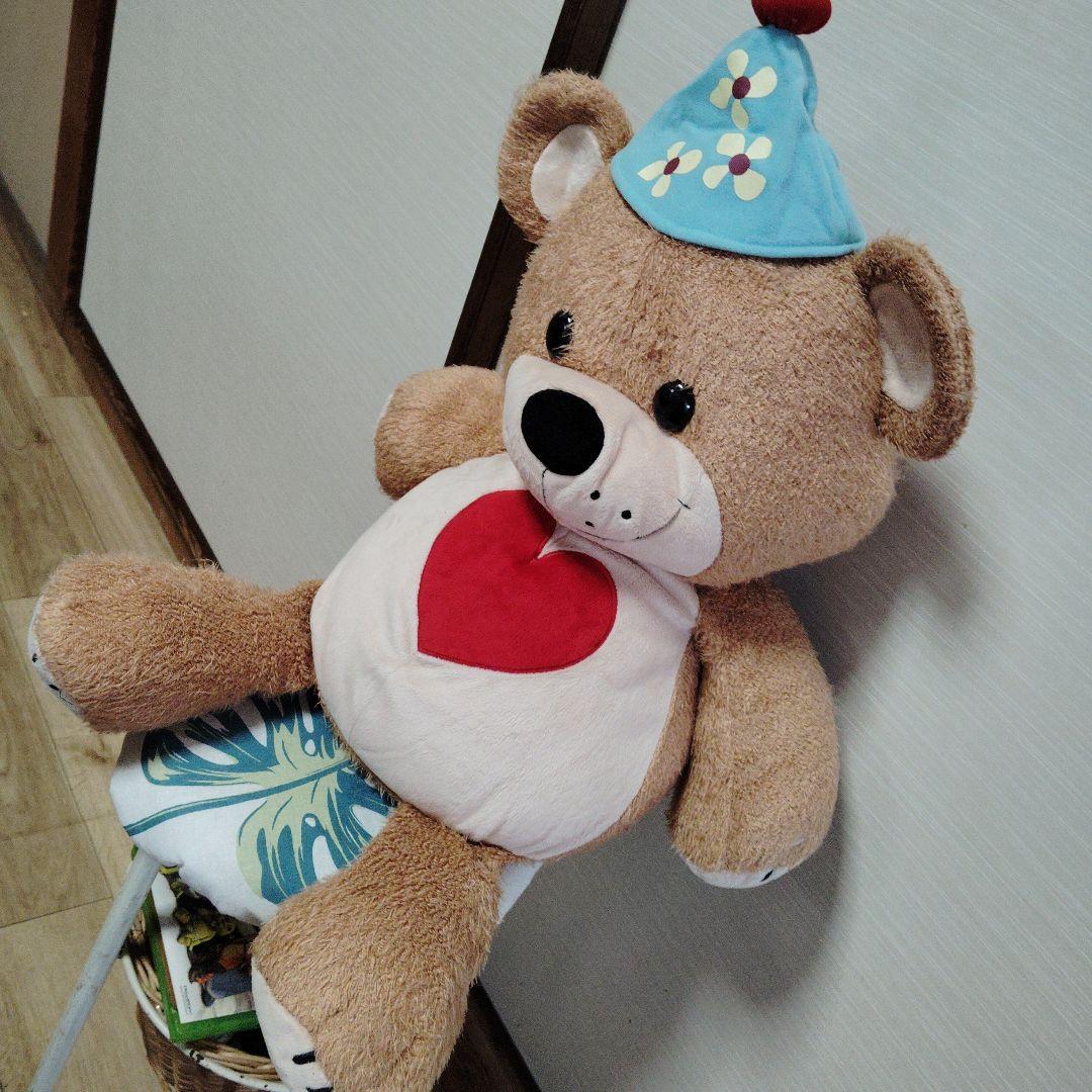 茶色いクマのぬいぐるみ 青い帽子付き