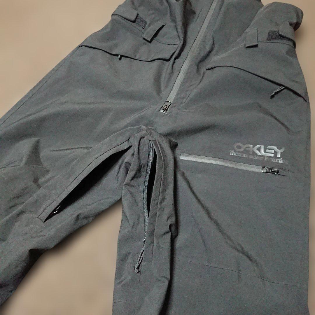 送料無料【OAKLEY】ブラック無地ビブパンツ L スノボやスキーに