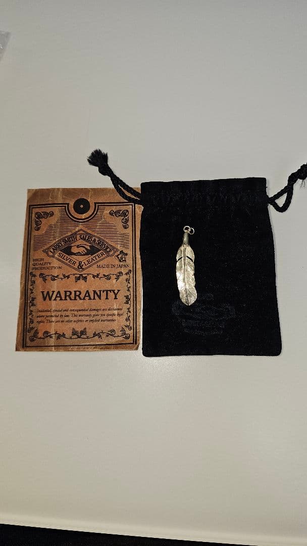 LARRY SMITHシルバー イーグルフェザー