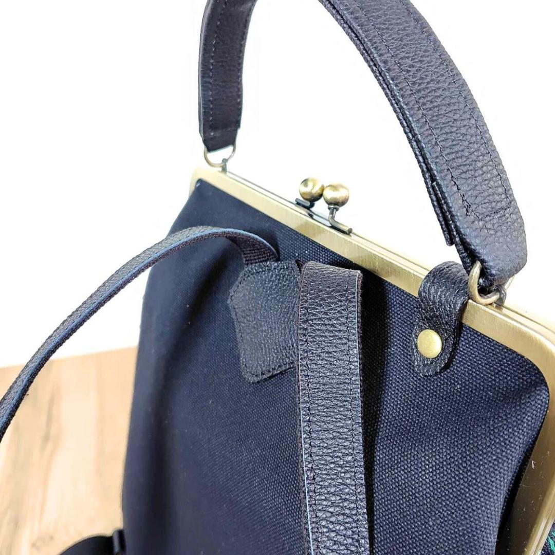 ミナペルホネン/2025rosyロージィーネイビー/がま口リュック牛革黒