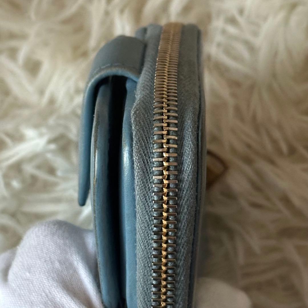 イヴサンローラン 二つ折り財布 型押し レザー ジップ ライトブルー コンパクト