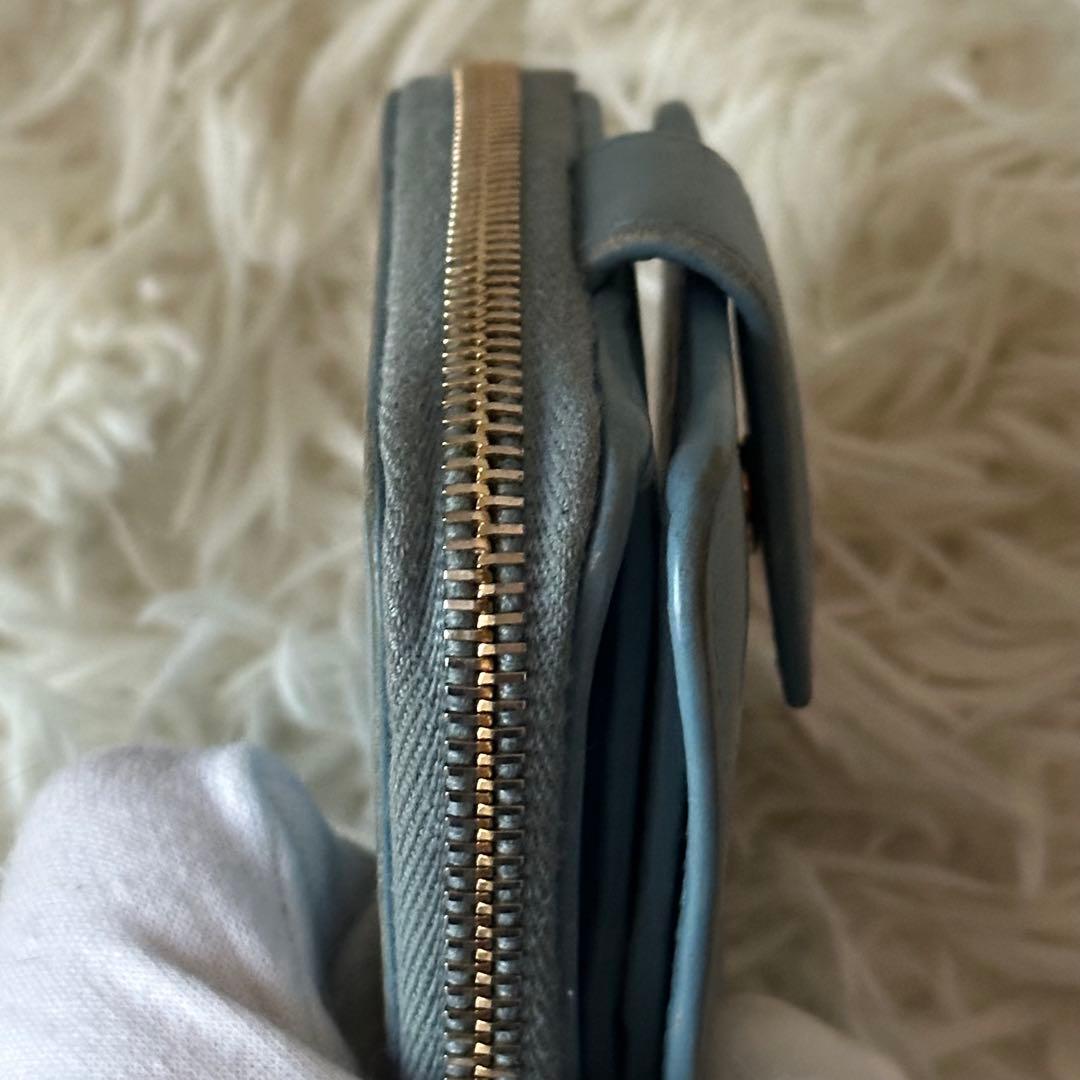 イヴサンローラン 二つ折り財布 型押し レザー ジップ ライトブルー コンパクト