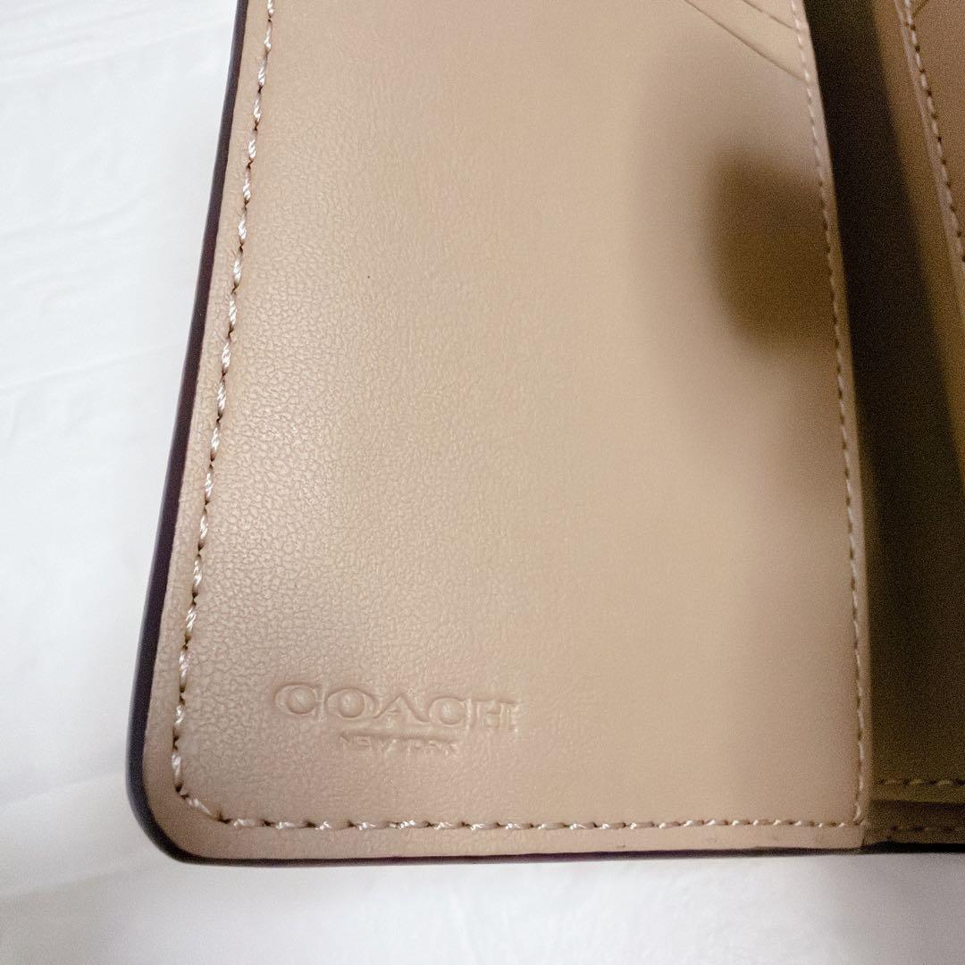 コーチ 二つ折り財布 シグネチャー ベージュ 白 coach
