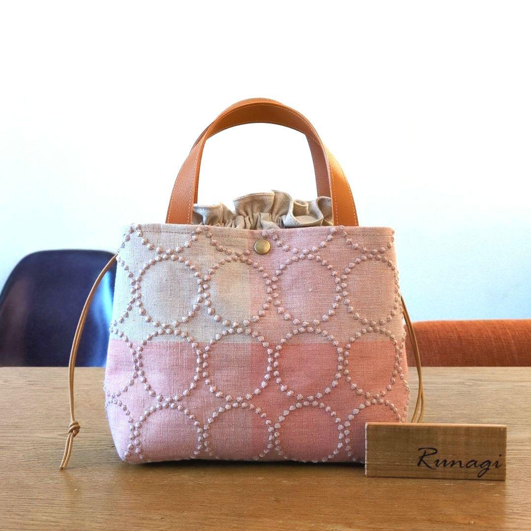 あおりポケットの巾着バッグ＊ミナペルホネン