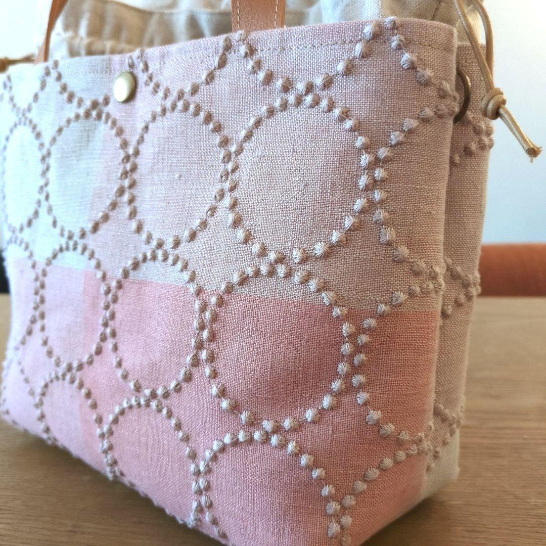 あおりポケットの巾着バッグ＊ミナペルホネン